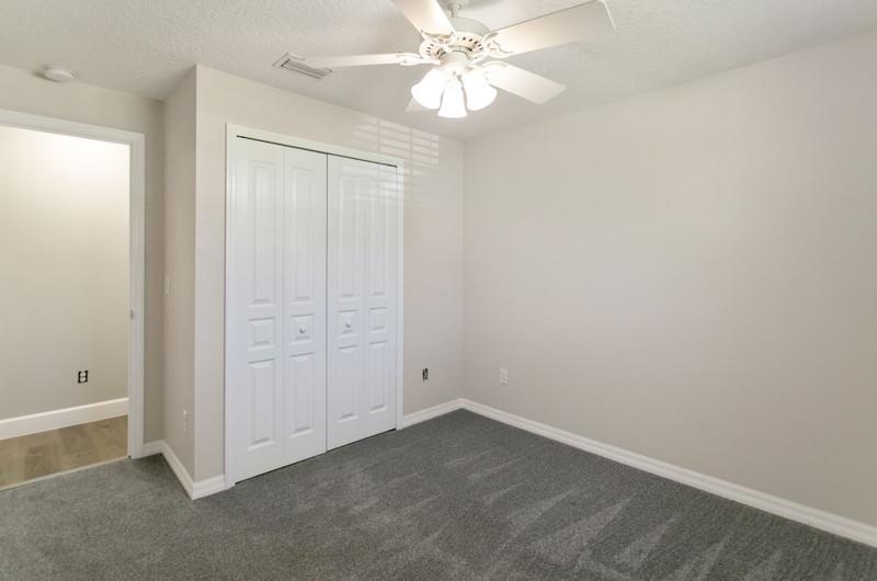347 Lobelia Road St. Augustine, FL 32086 - Photo 22 of 40 an empty room with a ceiling fan and a window
