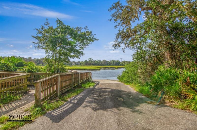 347 Lobelia Road St. Augustine, FL 32086 - Photo 34 of 40 a view of a lake with a garden