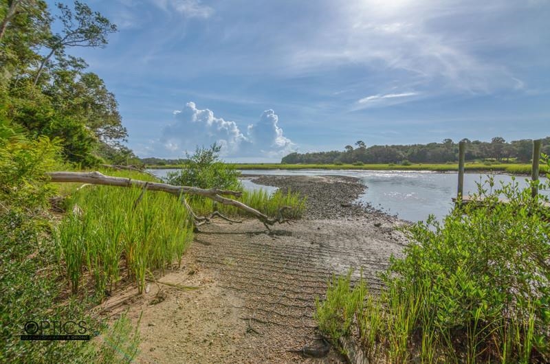 347 Lobelia Road St. Augustine, FL 32086 - Photo 39 of 40 a view of a lake with a big yard