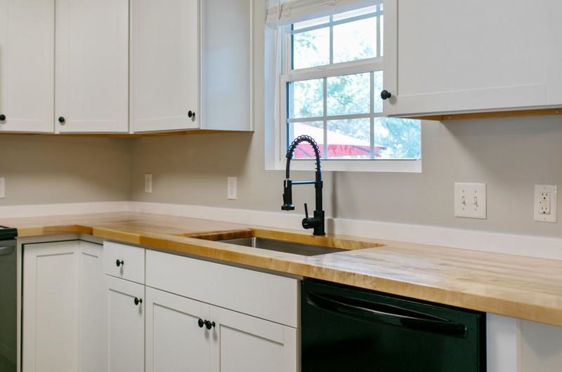 347 Lobelia Road St. Augustine, FL 32086 - Photo 8 of 40 a kitchen with a sink cabinets and window