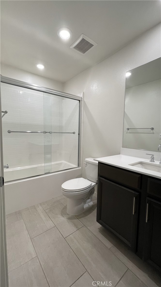 115 Citysquare Irvine, CA 92614 - Photo 14 of 30 a bathroom with a sink a toilet and a shower