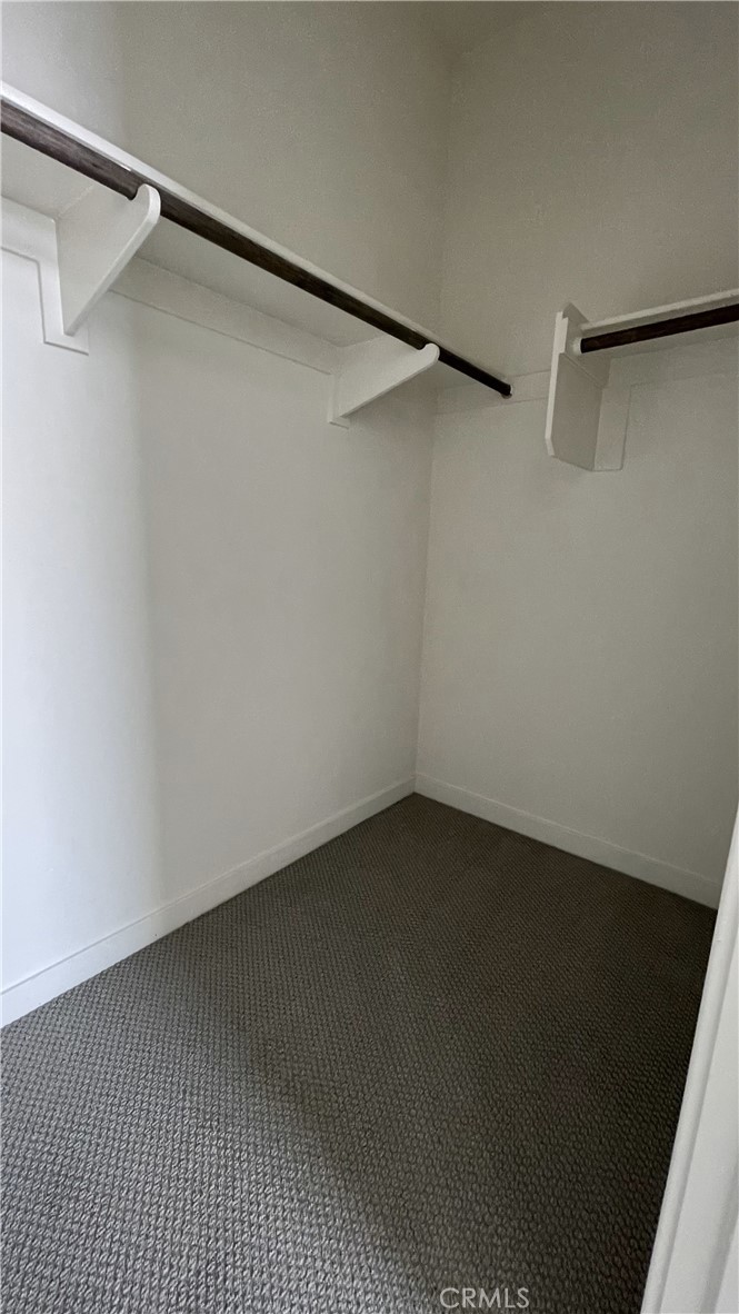 115 Citysquare Irvine, CA 92614 - Photo 23 of 30 a view of an empty walk in closet