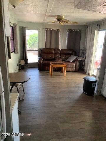 306 South Recker Road, Unit 134 Mesa, AZ 85206 - Photo 4 of 4 a living room with furniture and a flat screen tv