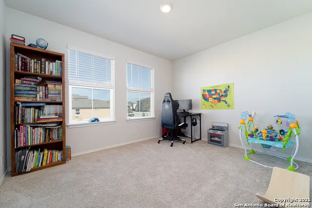 a view of a room with toys and a book shelf
