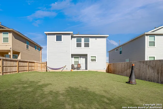 a view of backyard with a table and chair