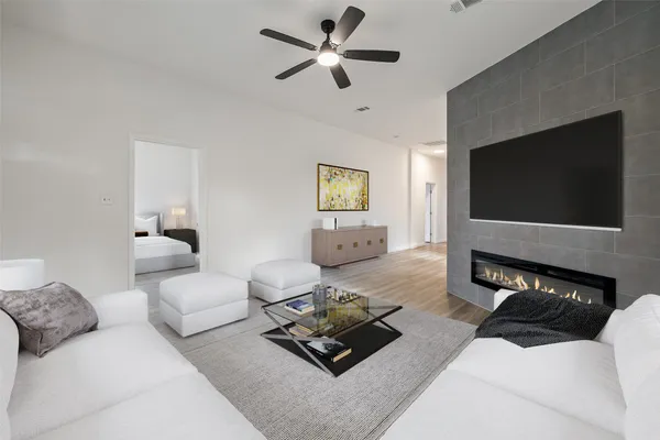 a living room with furniture and a flat screen tv