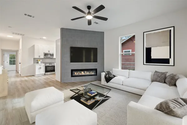 a living room with furniture and a fireplace