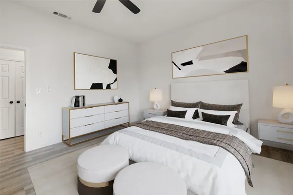 a bedroom with a bed and a dresser