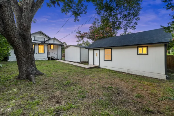 a view of a house with a yard