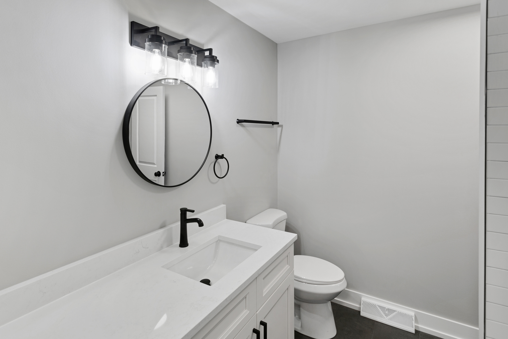 28W555 Leverenz Road Naperville, IL 60564 - Photo 15 of 24 a bathroom with a sink and a mirror