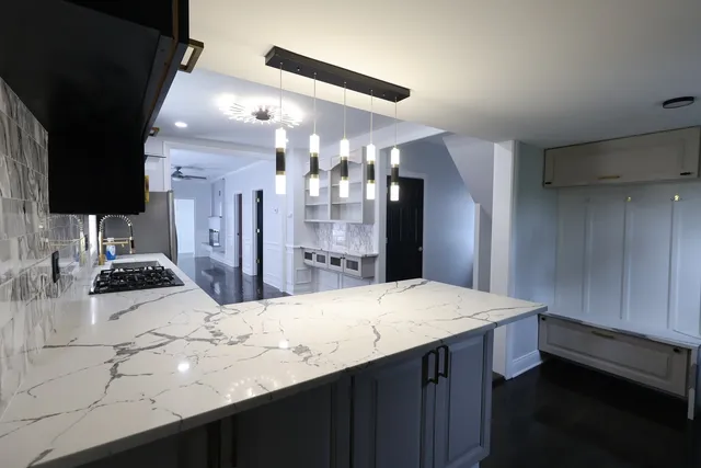 a kitchen with sink and refrigerator