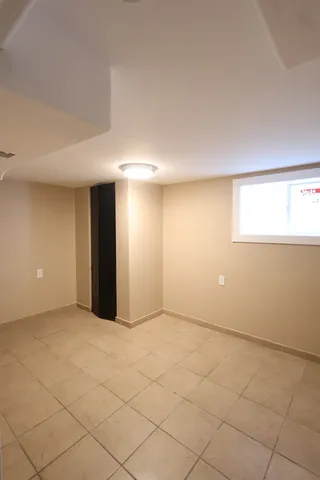 an empty room with a empty space and windows