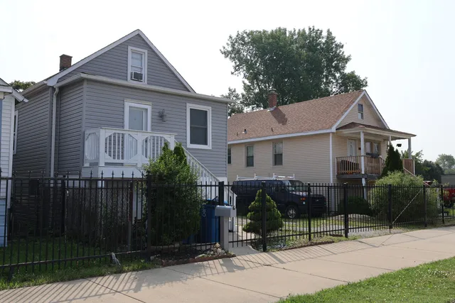 a view of a house with a yard and plants