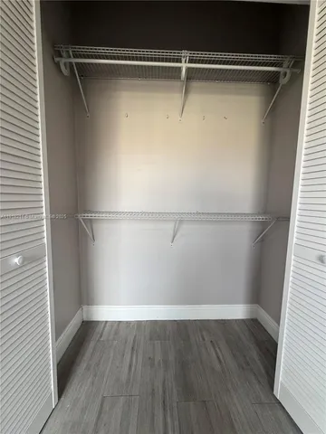 a view of an empty walk in closet