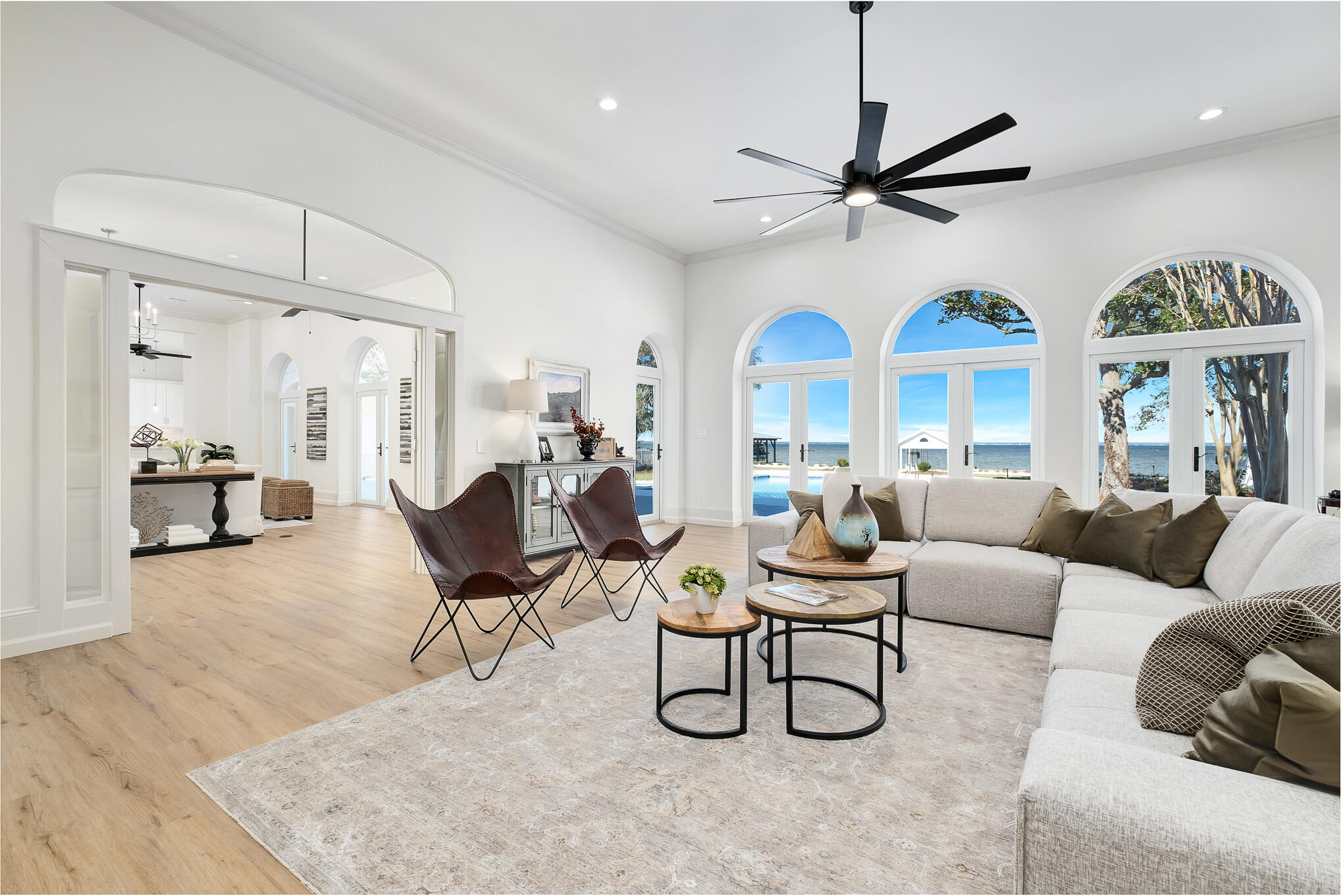 4105 Indian Trail Destin, FL 32541 - Photo 17 of 70 a living room with furniture a large window and a chandelier