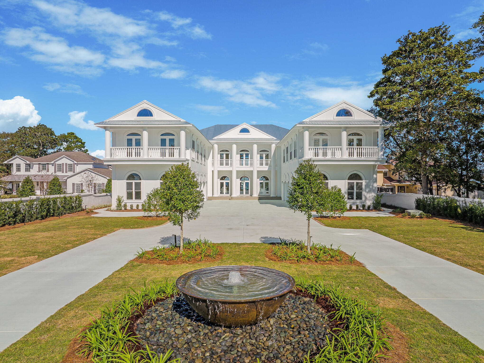 4105 Indian Trail Destin, FL 32541 - Photo 2 of 70 a front view of a house with a yard