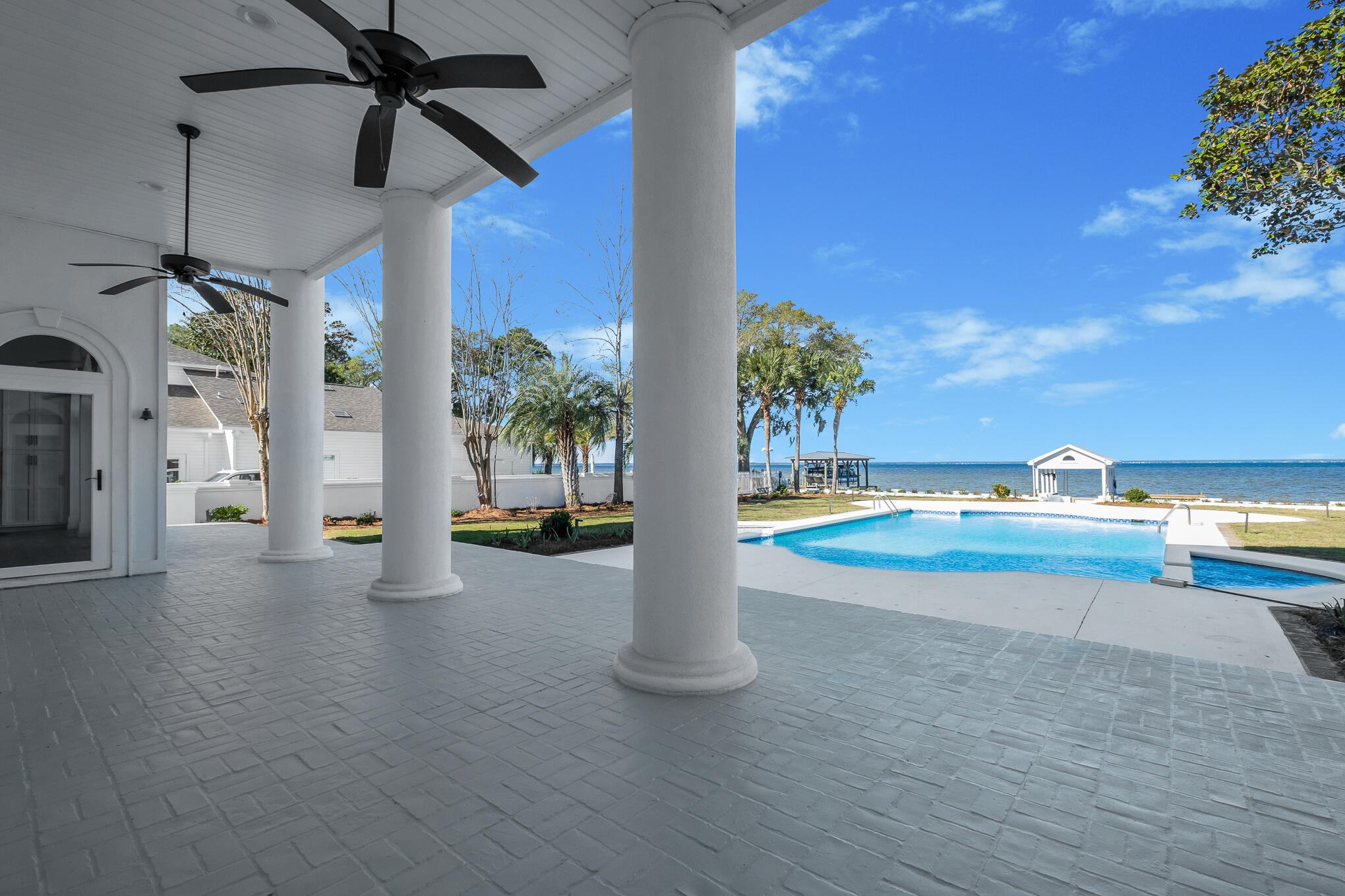 4105 Indian Trail Destin, FL 32541 - Photo 23 of 70 a view of a living room with a floor to ceiling window and a yard