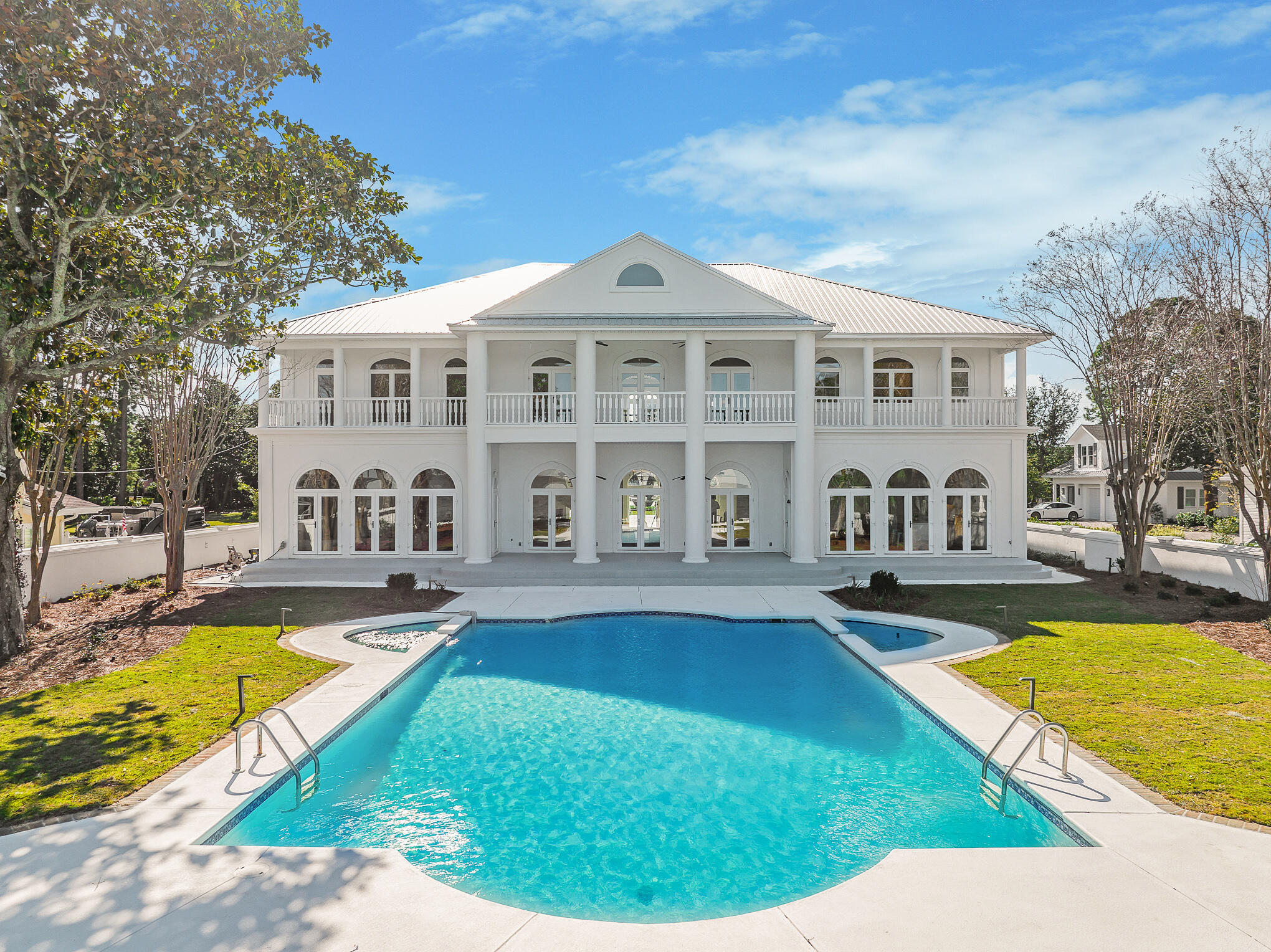 4105 Indian Trail Destin, FL 32541 - Photo 25 of 70 a view of a house with swimming pool and a yard