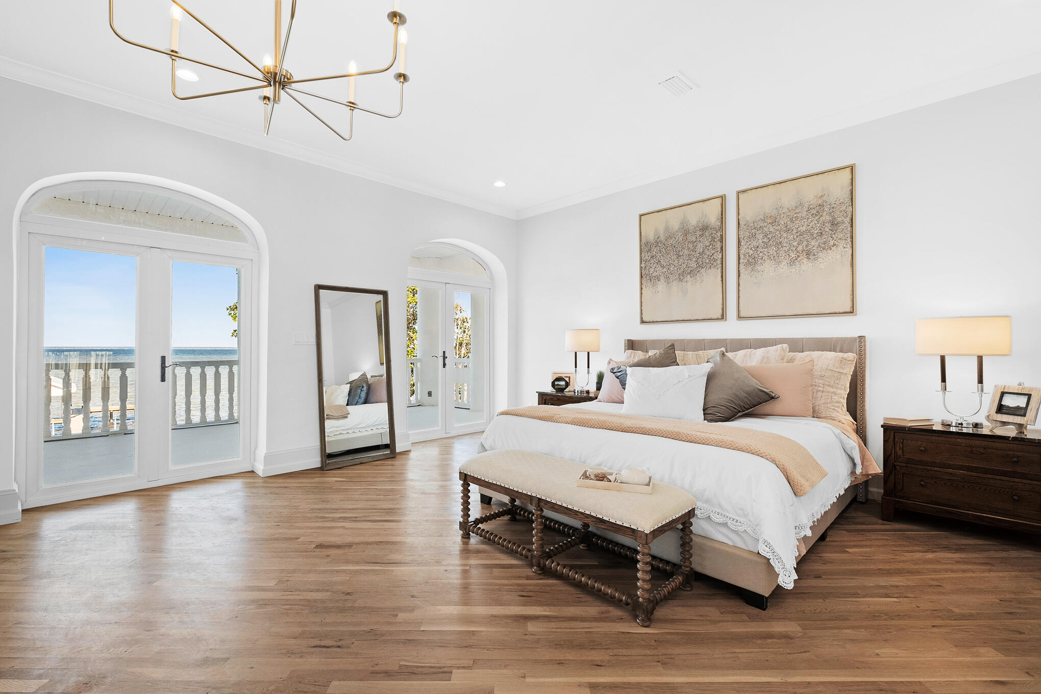 4105 Indian Trail Destin, FL 32541 - Photo 27 of 70 a spacious bedroom with a bed a dresser and wooden floor