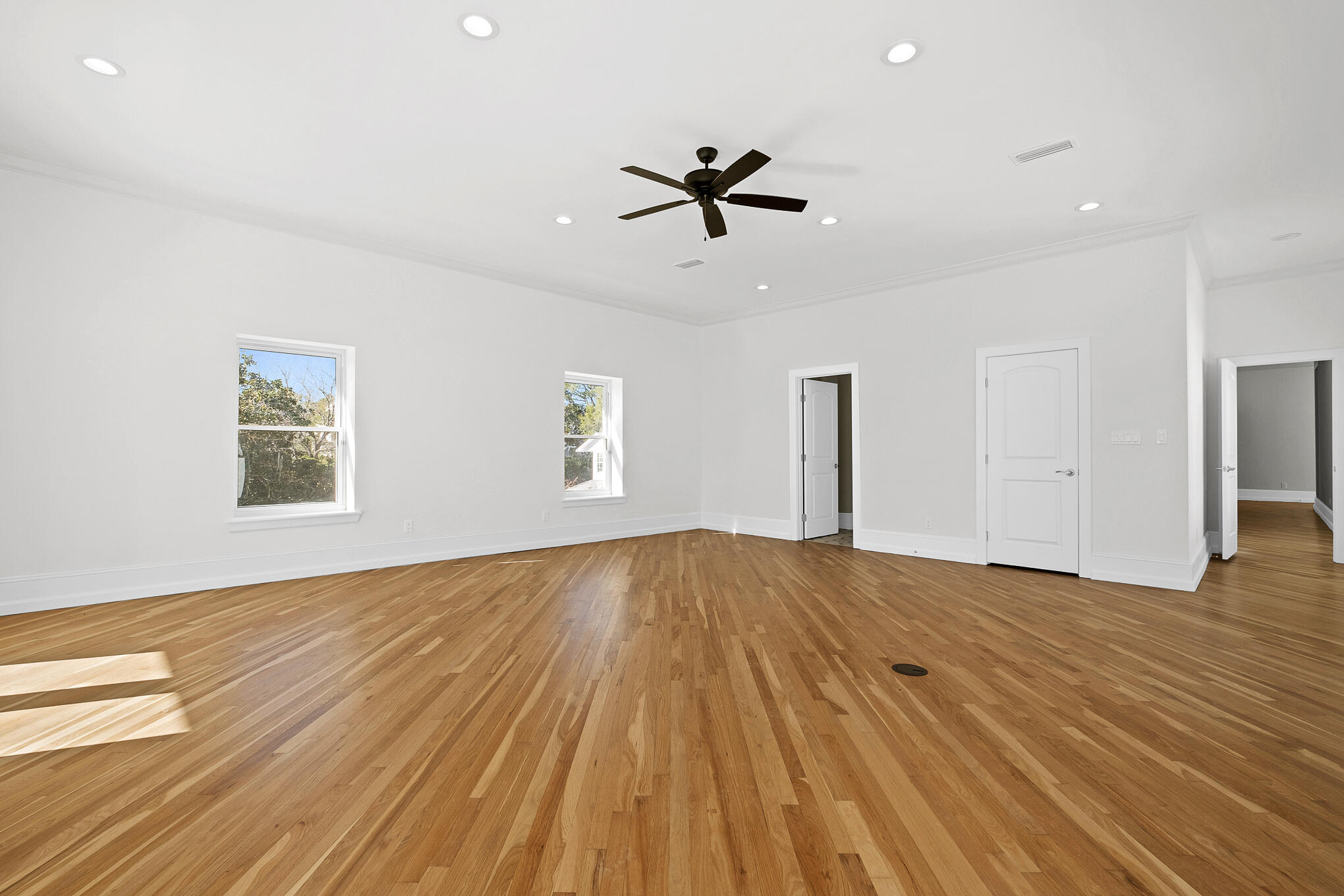 4105 Indian Trail Destin, FL 32541 - Photo 43 of 70 a view of empty room with wooden floor and ceiling fan