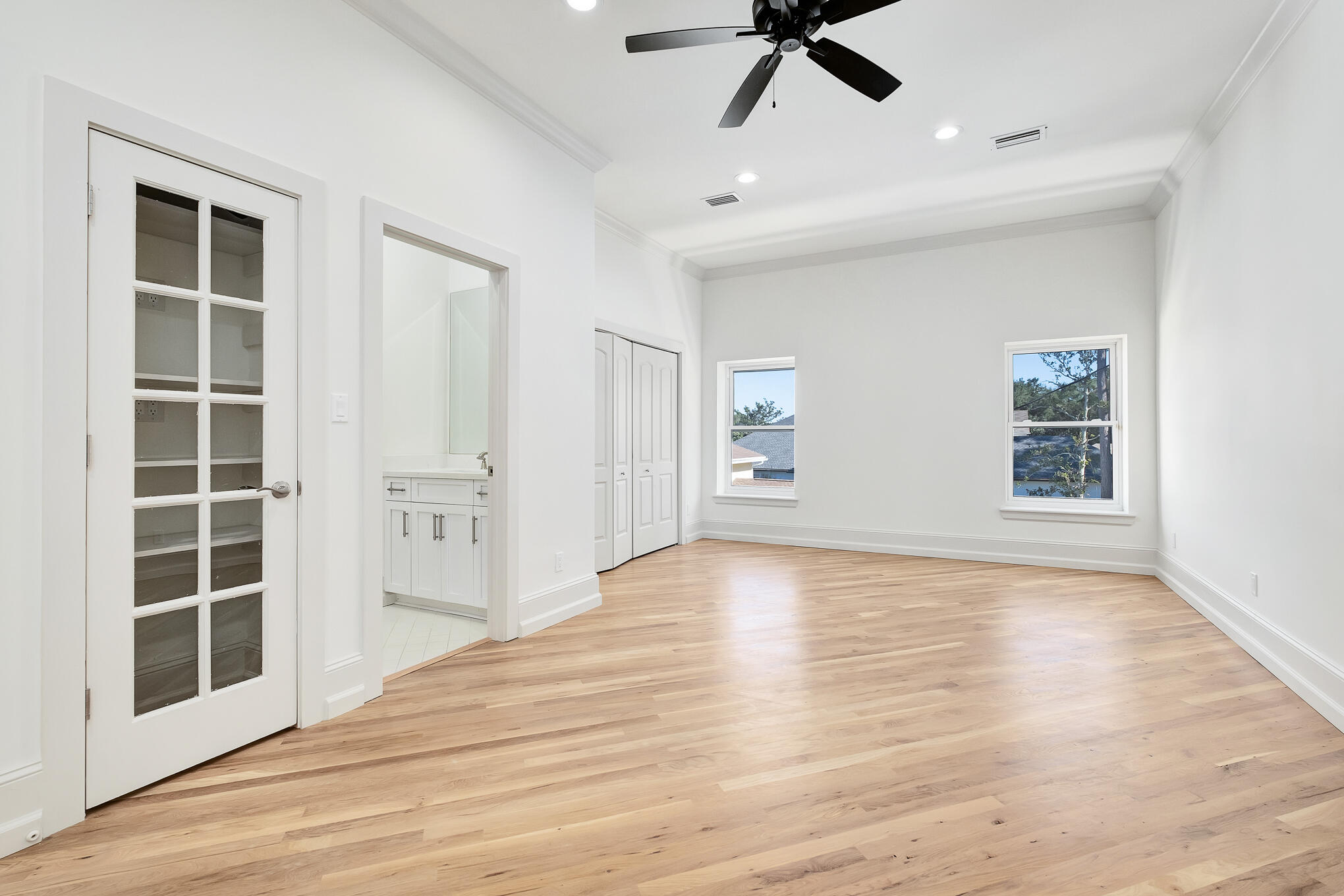 4105 Indian Trail Destin, FL 32541 - Photo 48 of 70 a view of an empty room with a window and wooden floor