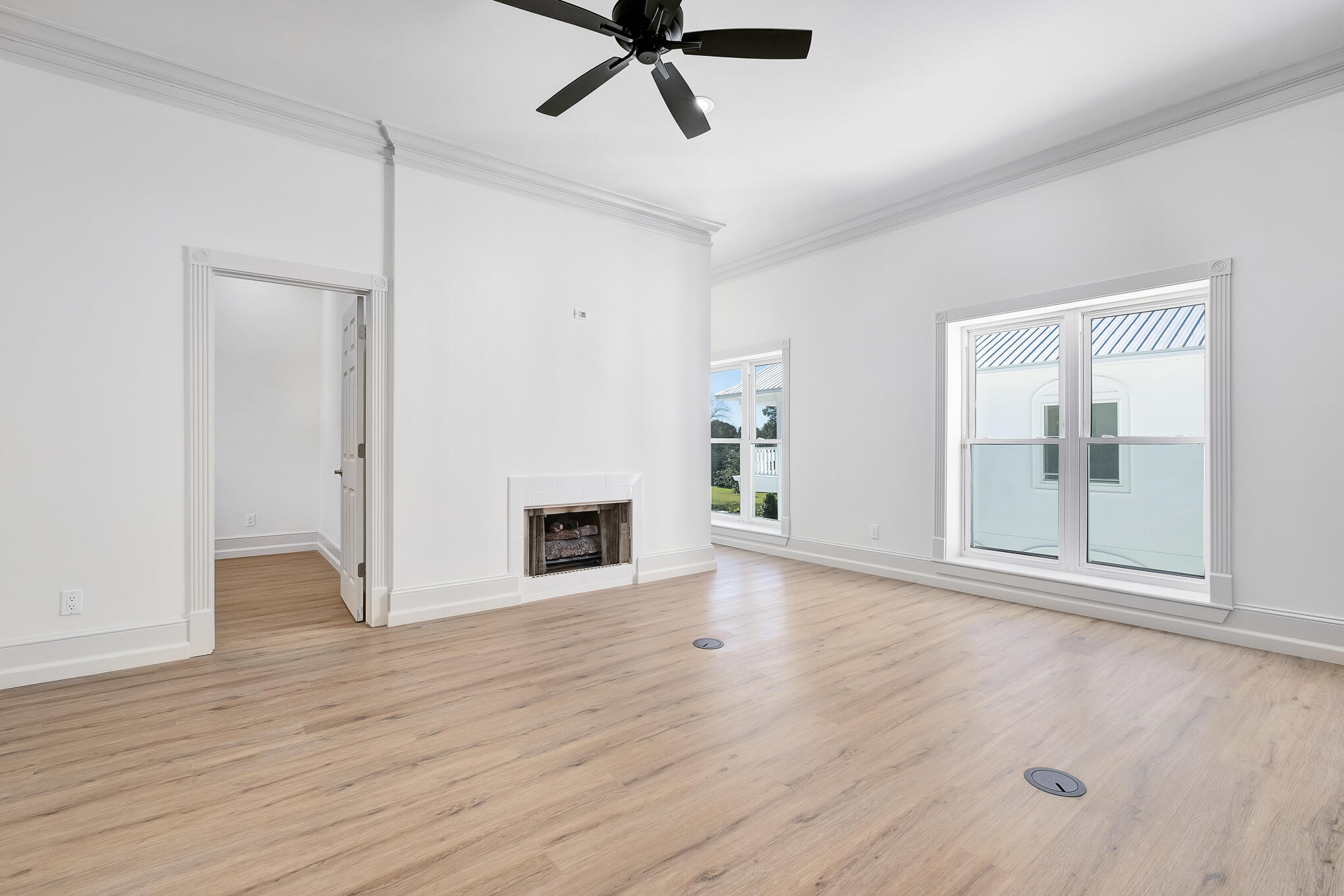 4105 Indian Trail Destin, FL 32541 - Photo 61 of 70 an empty room with wooden floor and a ceiling fan