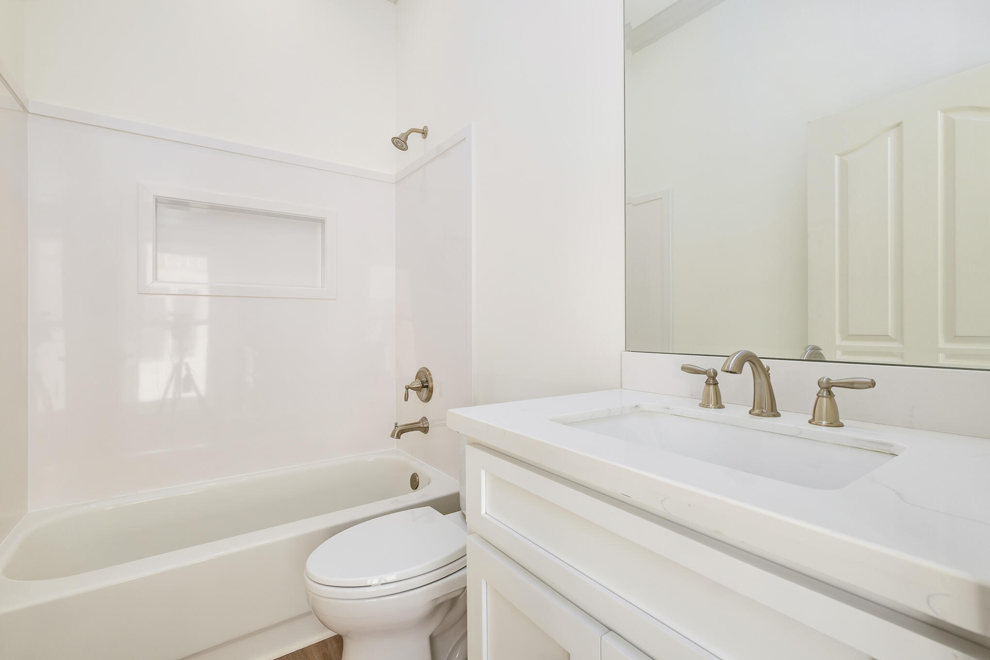 4105 Indian Trail Destin, FL 32541 - Photo 67 of 70 a bathroom with a granite countertop sink a toilet and bathtub