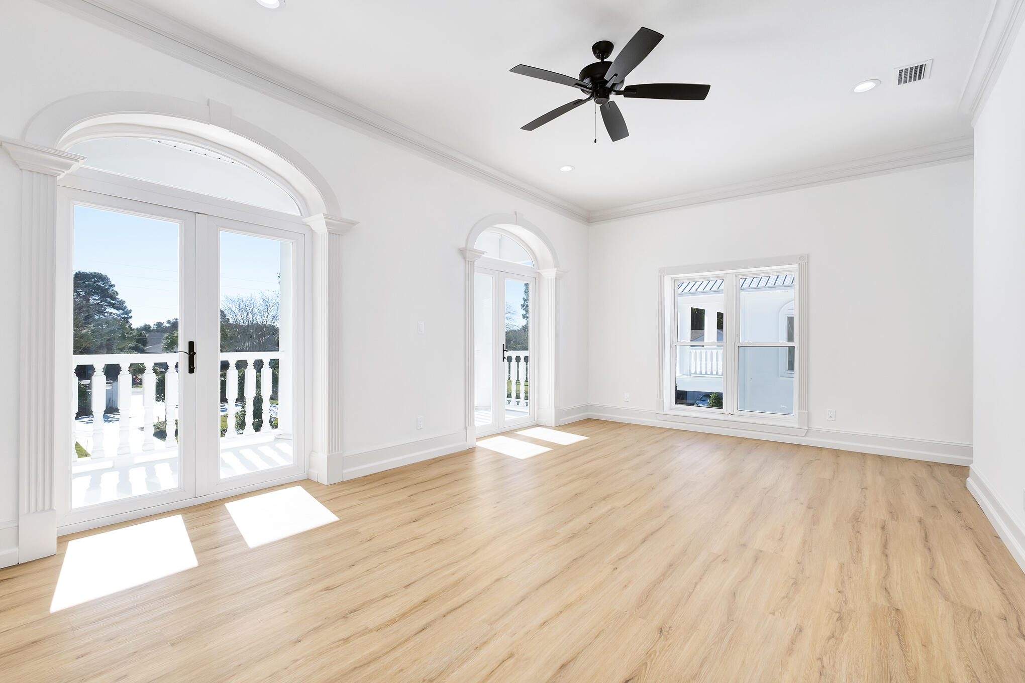 4105 Indian Trail Destin, FL 32541 - Photo 68 of 70 a view of a big room with wooden floor and a ceiling fan