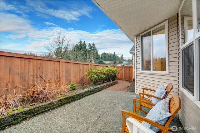 a spacious bedroom with a bed and a window