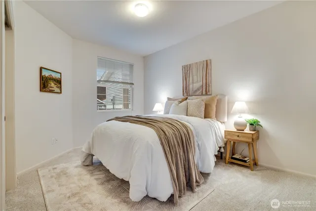 a bathroom with a granite countertop sink a toilet and a bathtub