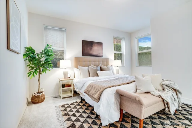 a bathroom with a granite countertop shower and a toilet
