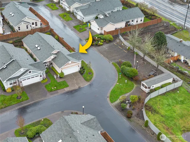 an aerial view of a house with a swimming pool