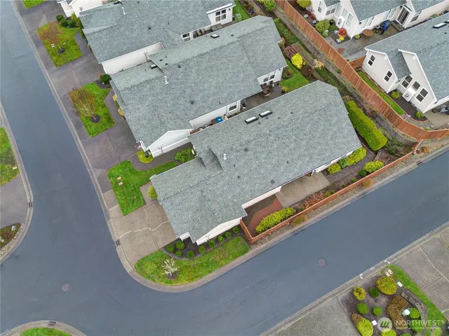 an aerial view of a house with a swimming pool