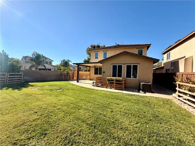 a front view of house with yard and seating area