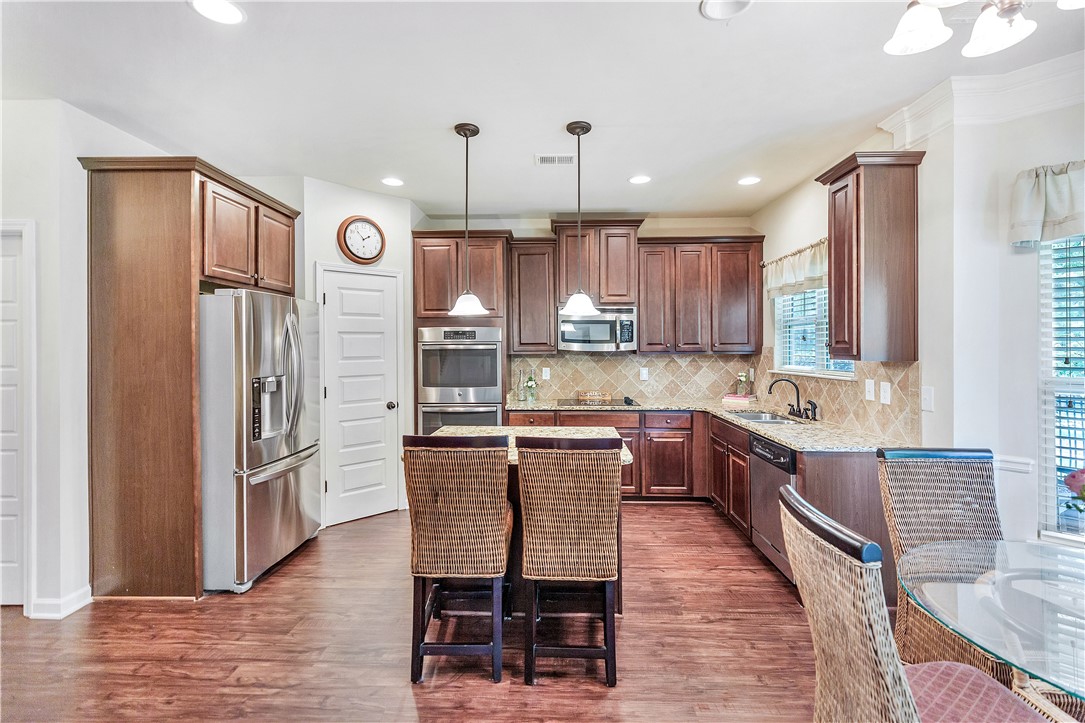 144 Buckland Drive Anderson, SC 29621 - Photo 32 of 48 Culinary delights await in this modern kitchen with rich cabinetry and durable flooring.
