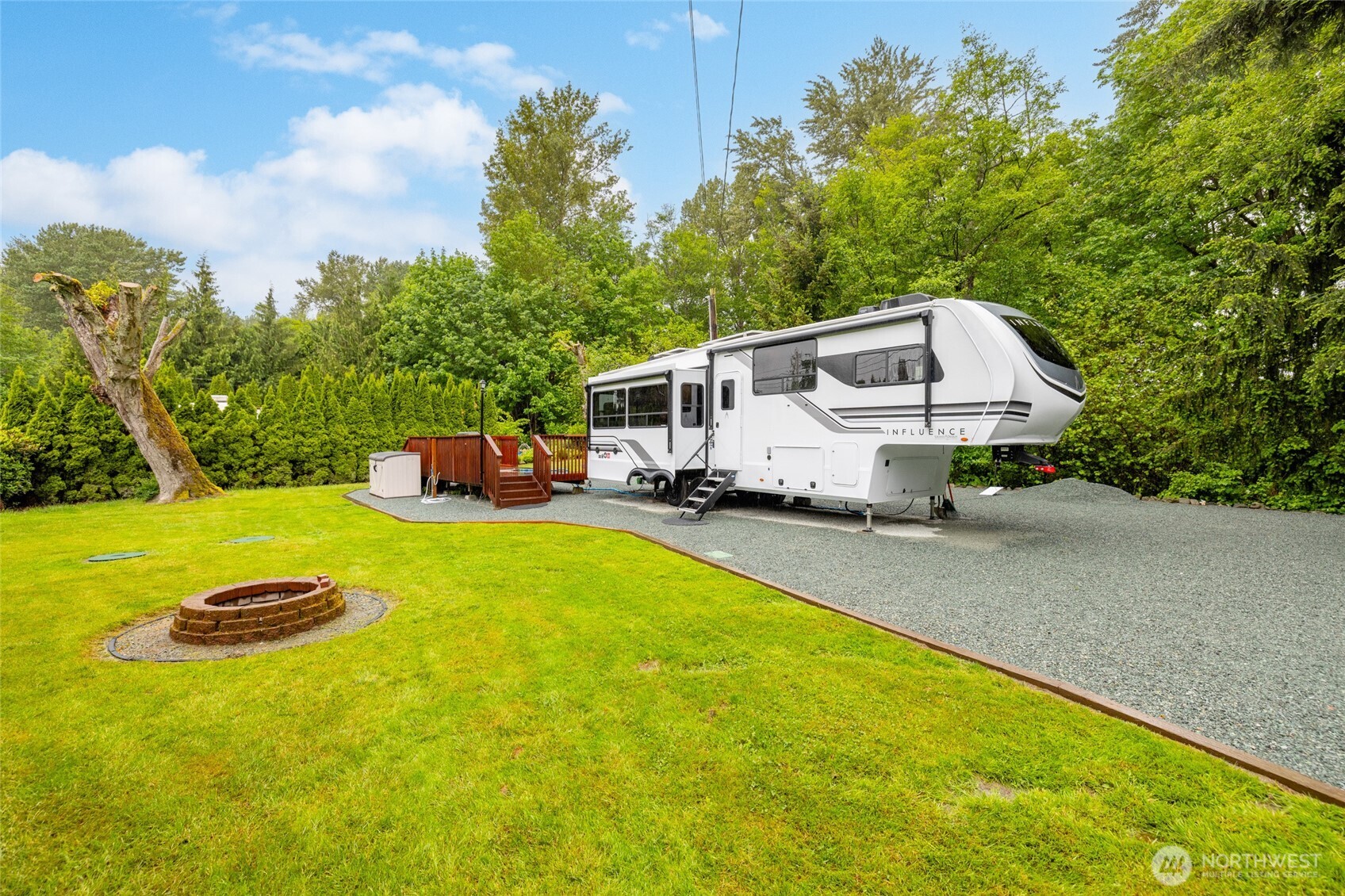 23801 Cove Road Sedro-Woolley, WA 98284 - Photo 4 of 34 a house view with swimming pool and trees in the background