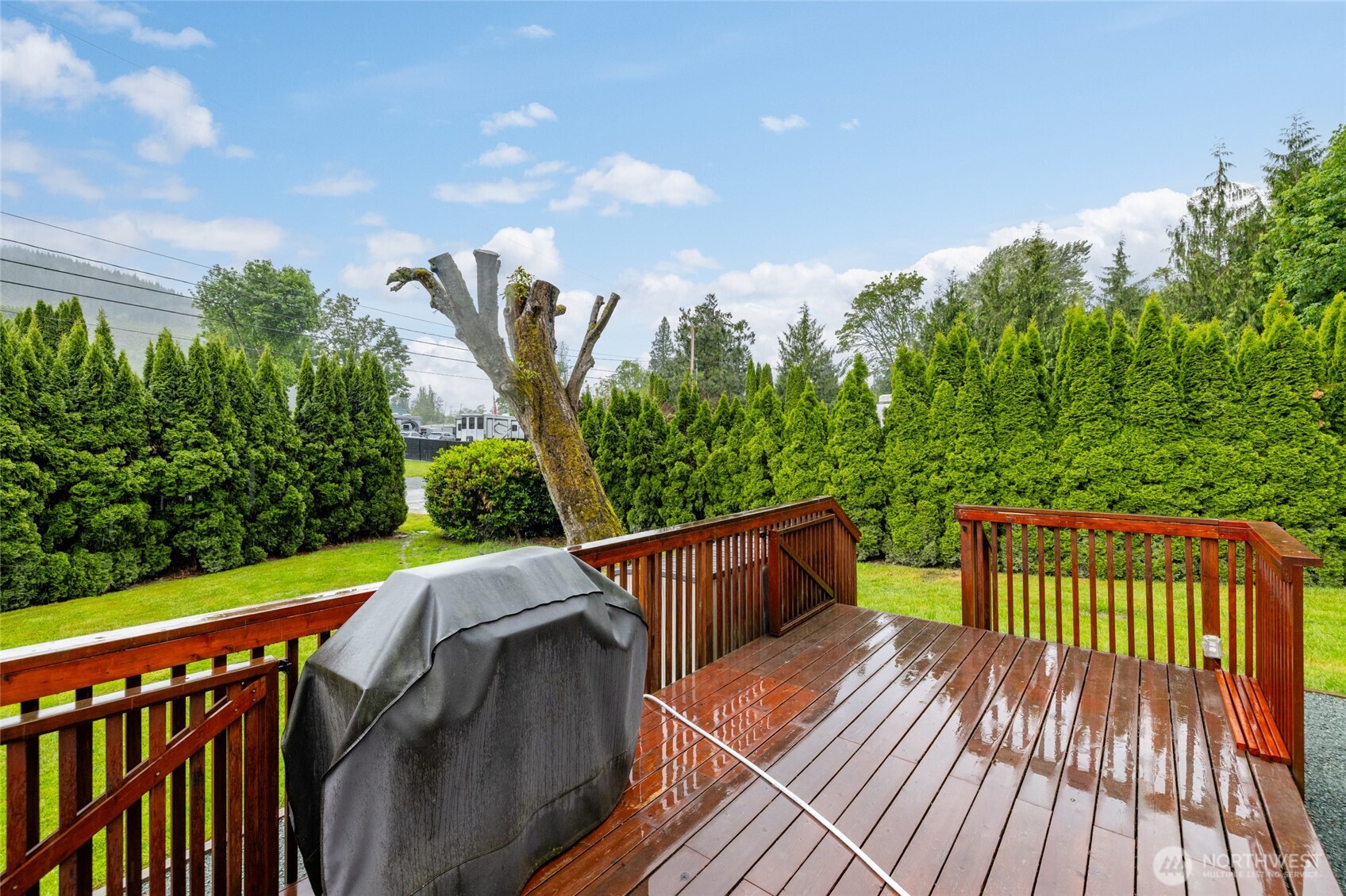 23801 Cove Road Sedro-Woolley, WA 98284 - Photo 10 of 34 a balcony with wooden floor and outdoor seating
