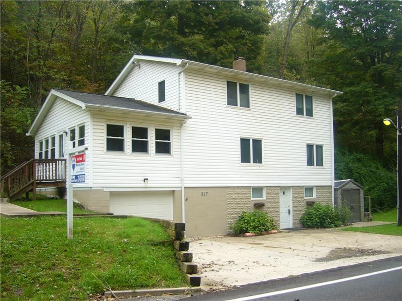317 Kelley Road Industry, PA 15052 - Photo 1 of 21 The cement driveway can fit three cars, plus the integral garage!