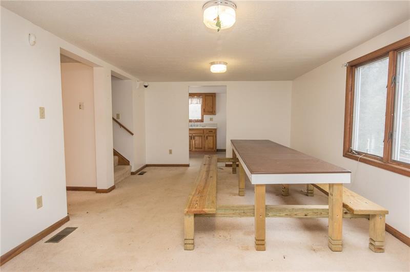 317 Kelley Road Industry, PA 15052 - Photo 6 of 21 This area was used for a dining room. Room to gather with friends and family. Plenty of space, no one left out!