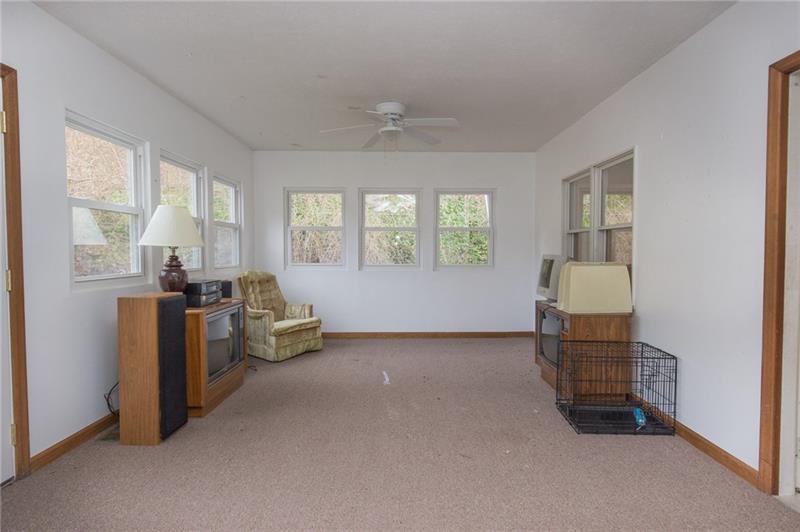 317 Kelley Road Industry, PA 15052 - Photo 7 of 21 First floor four season room, with access to the outdoors, or the spacious dining room.