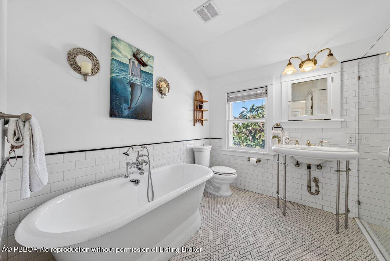 307 Wildermere Road West Palm Beach, FL 33401 - Photo 30 of 53 a bathroom with a sink and a mirror