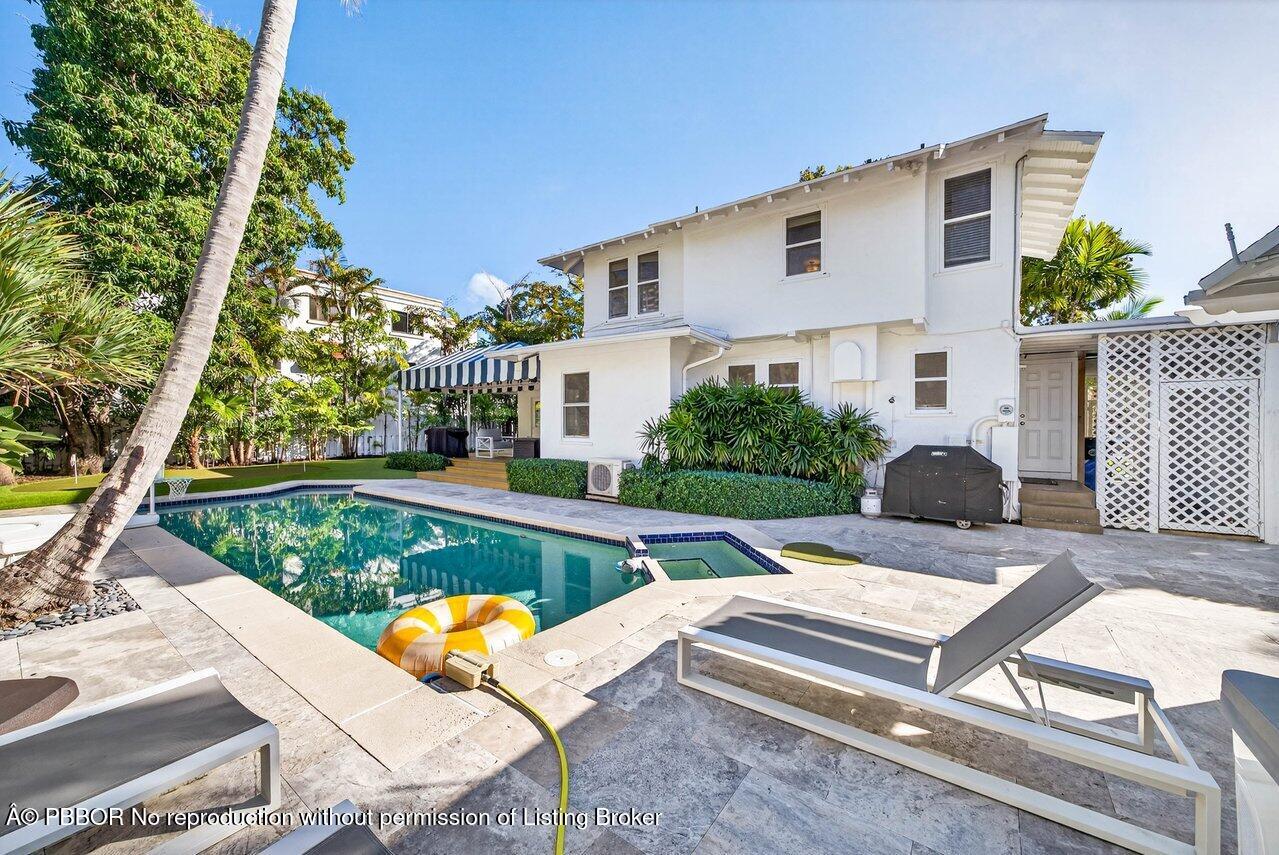307 Wildermere Road West Palm Beach, FL 33401 - Photo 37 of 53 a view of a patio with couches table and chairs with wooden fence and plants