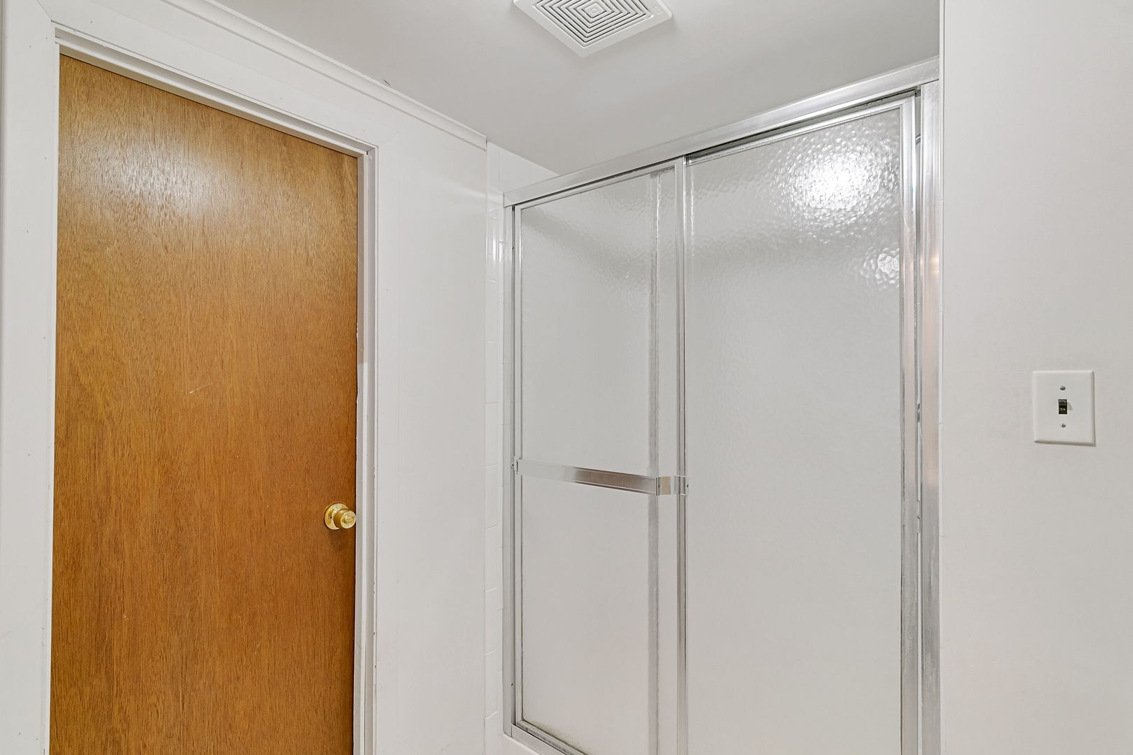 2549 2nd Avenue North Riverside, IL 60546 - Photo 12 of 18 a bathroom with a glass shower door and a bathroom sink