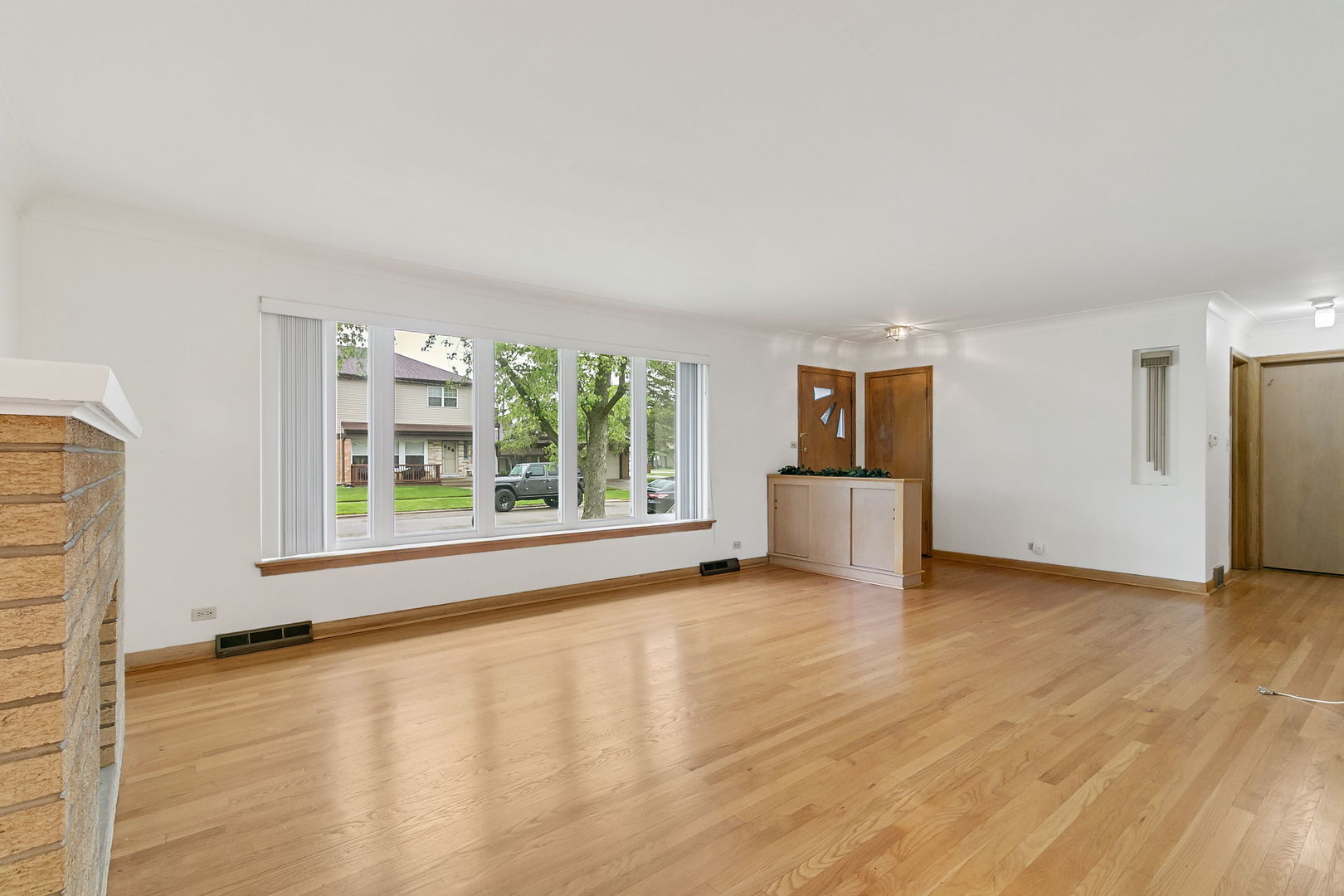 2549 2nd Avenue North Riverside, IL 60546 - Photo 2 of 18 a view of an empty room with a window and wooden floor