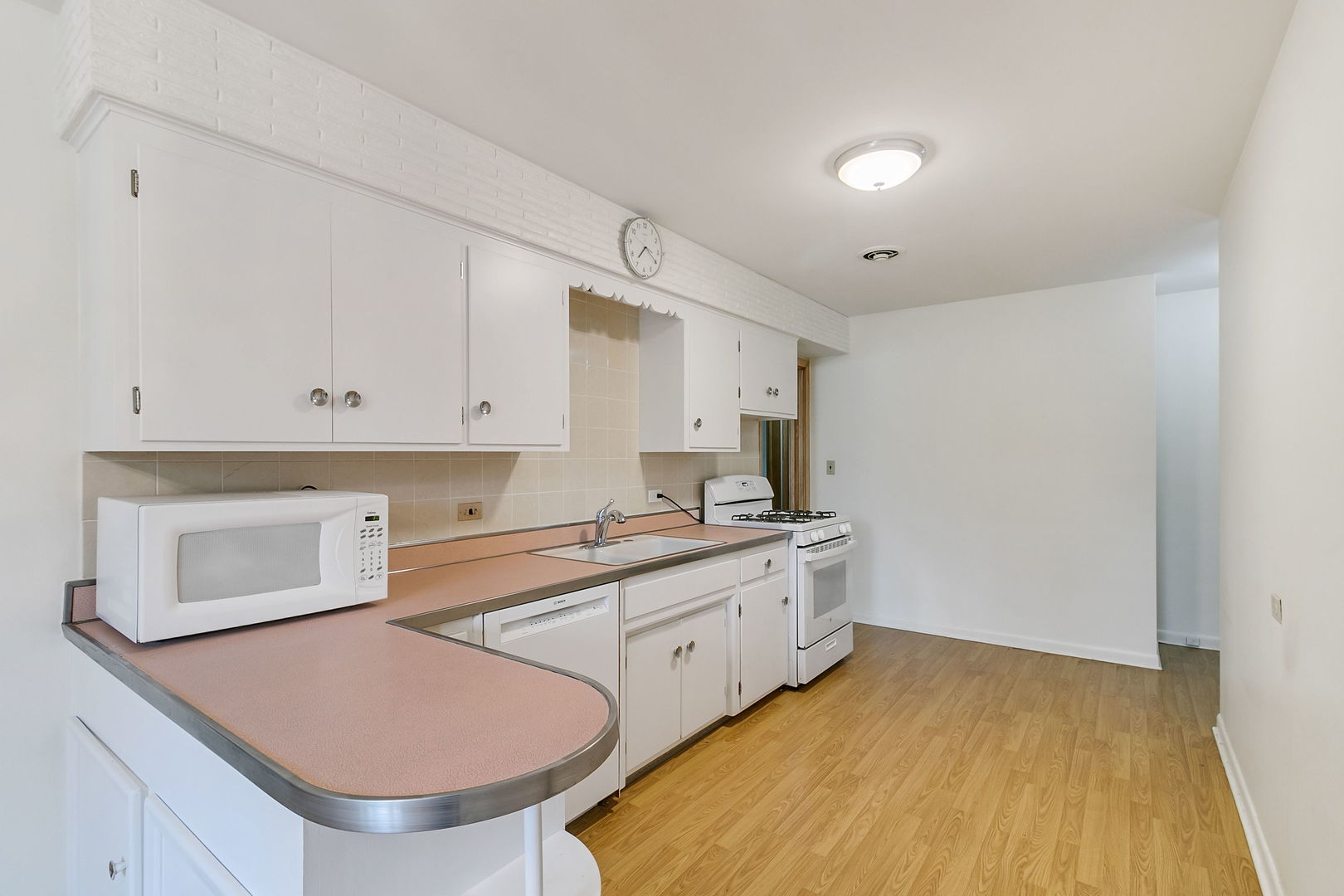 2549 2nd Avenue North Riverside, IL 60546 - Photo 6 of 18 a kitchen with stainless steel appliances a stove a sink and a refrigerator