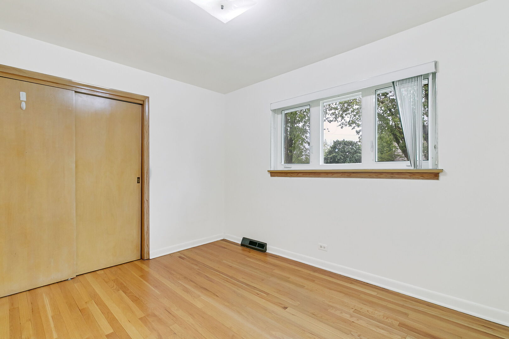 2549 2nd Avenue North Riverside, IL 60546 - Photo 7 of 18 an empty room with wooden floor and a window