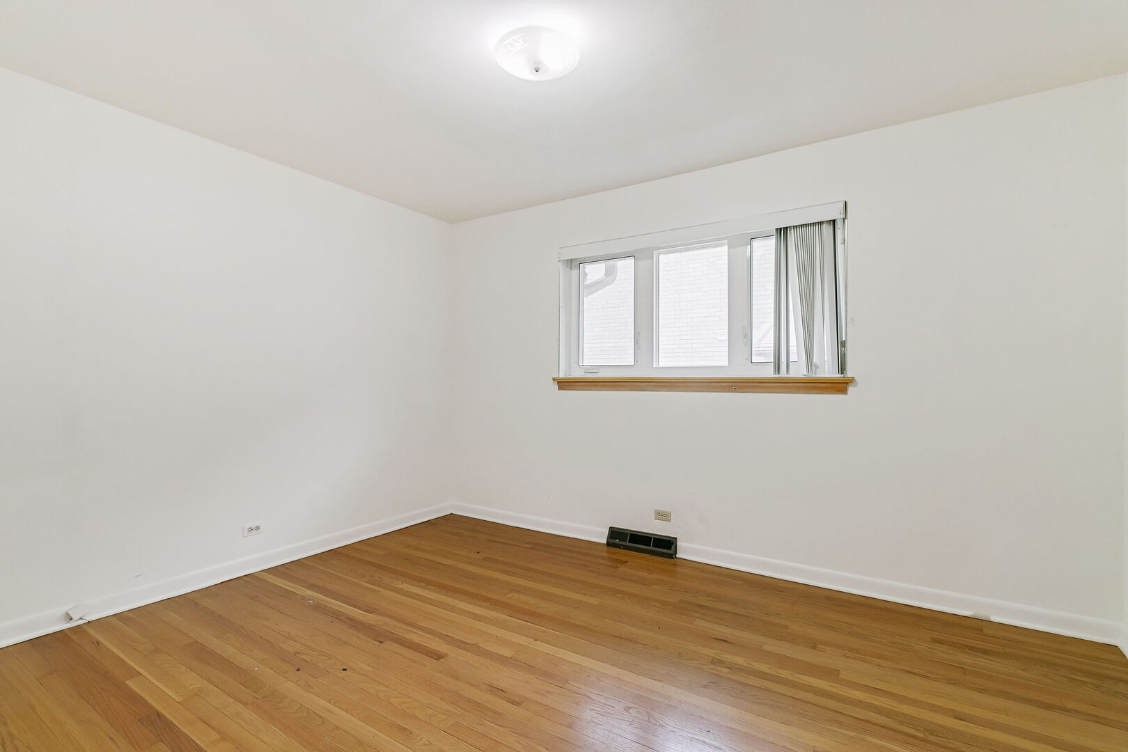 2549 2nd Avenue North Riverside, IL 60546 - Photo 9 of 18 an empty room with wooden floor and windows