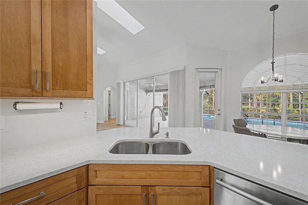 15031 Surrey Bend Spring Hill, FL 34609 - Photo 22 of 77 a kitchen with a sink and cabinets