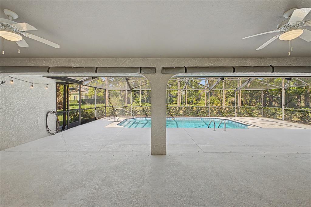 15031 Surrey Bend Spring Hill, FL 34609 - Photo 34 of 77 a view of an empty room with a sliding door