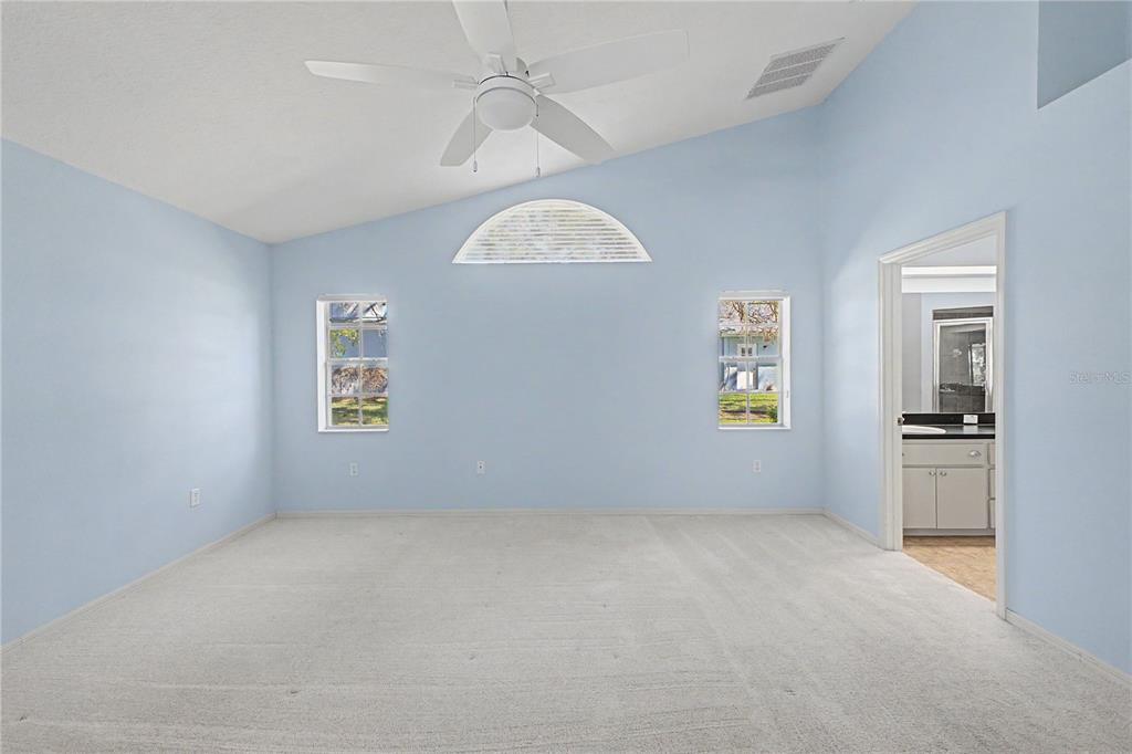 15031 Surrey Bend Spring Hill, FL 34609 - Photo 36 of 77 an empty room with windows and fan